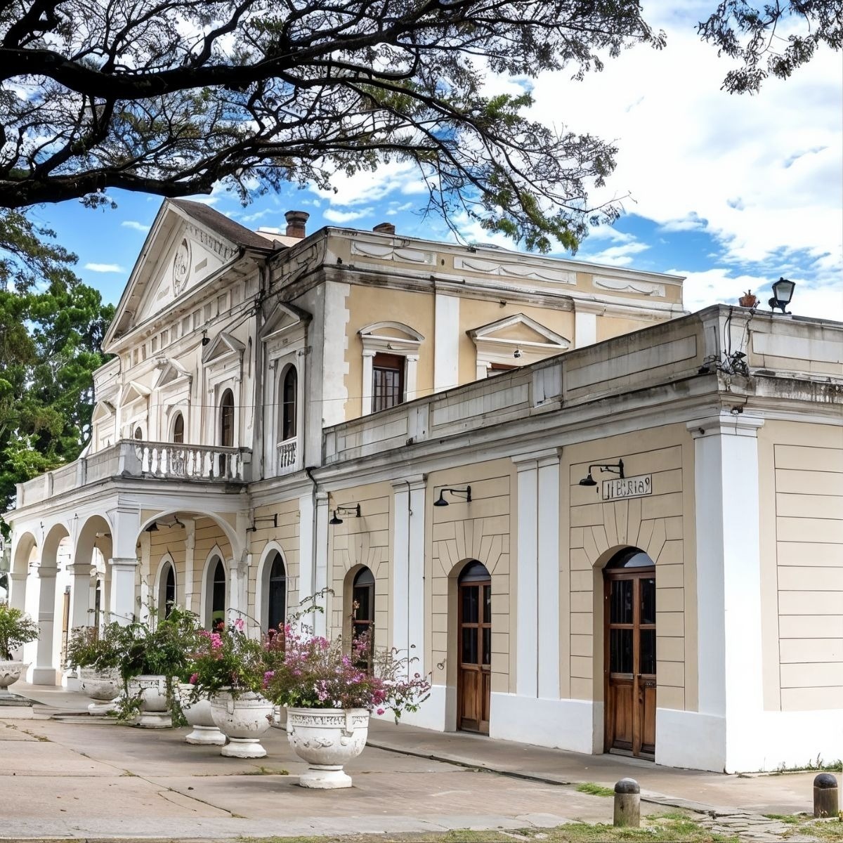 Hotel Tequendama: Corporativa facade with balcony, arches, and flowers.