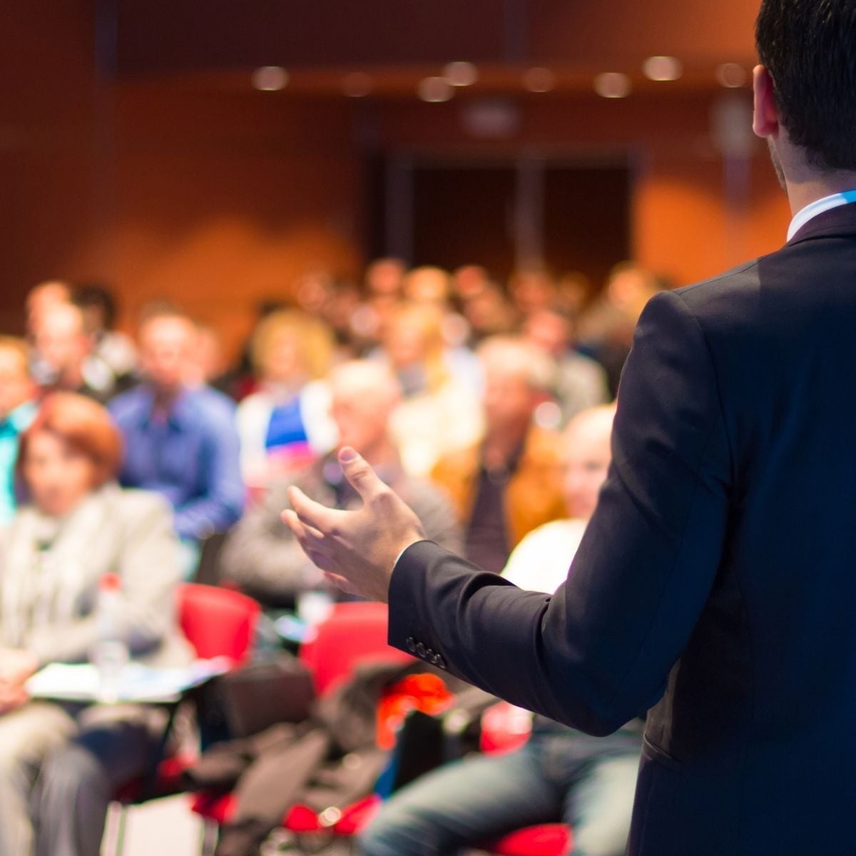 Speaker at Tequendama corporate event: professional and focused atmosphere.