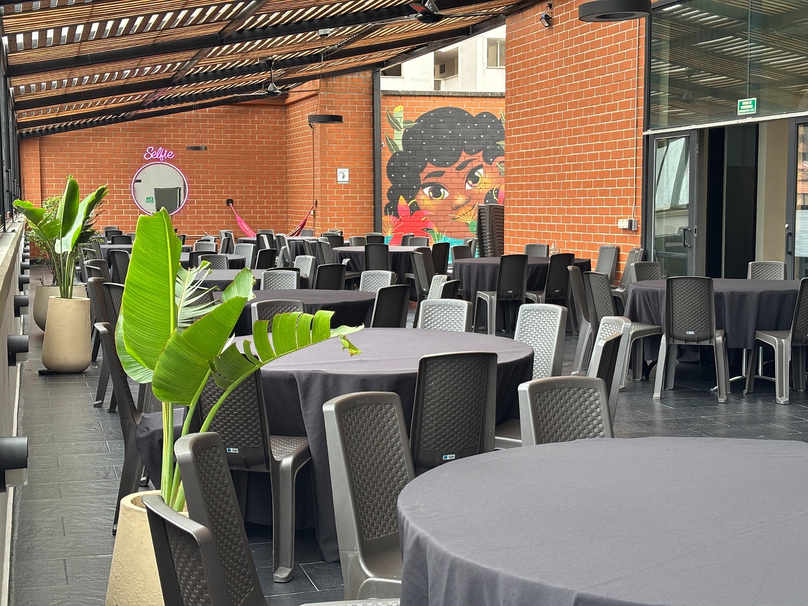 Rooftop venue at Tequendama: Corporativa, with tables and chairs for events.