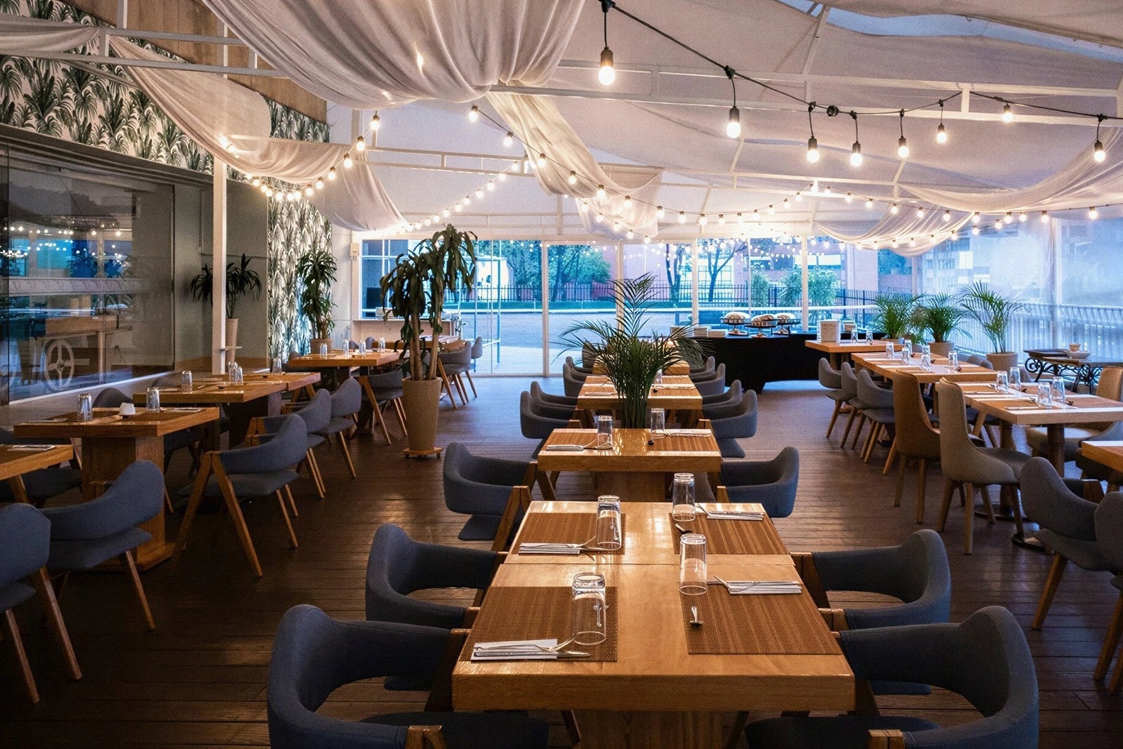 Stylish outdoor dining area at Tequendama Suites Bogotá, perfect for a central Bogotá experience.