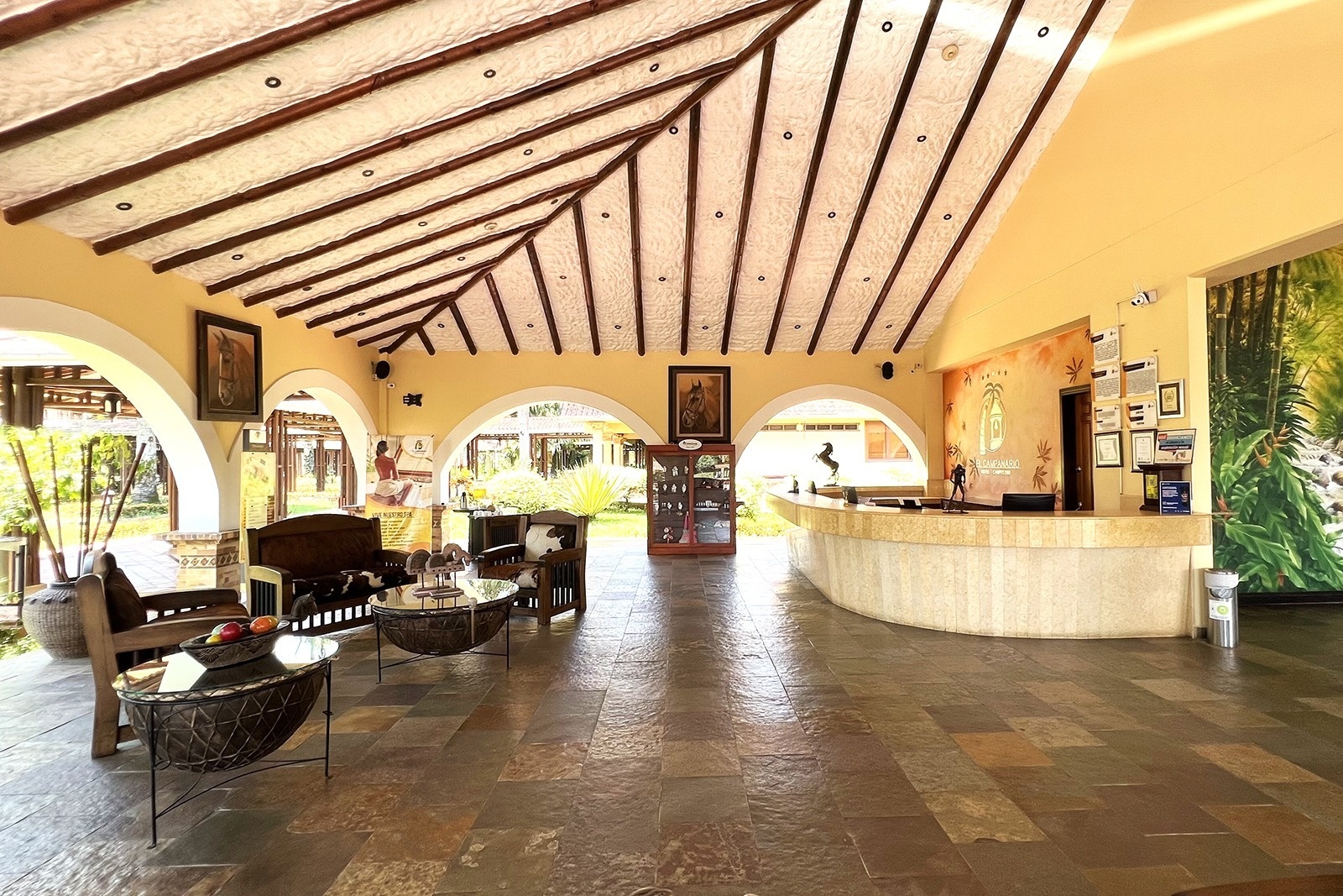 Tequendama: Corporativa Hotel Lobby with reception desk and waiting area.