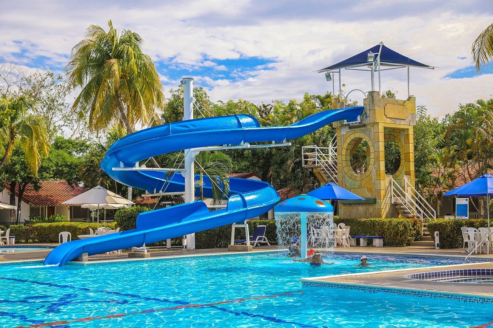 Blue water slide and pool at Tequendama hotel: Corporate relaxation awaits.