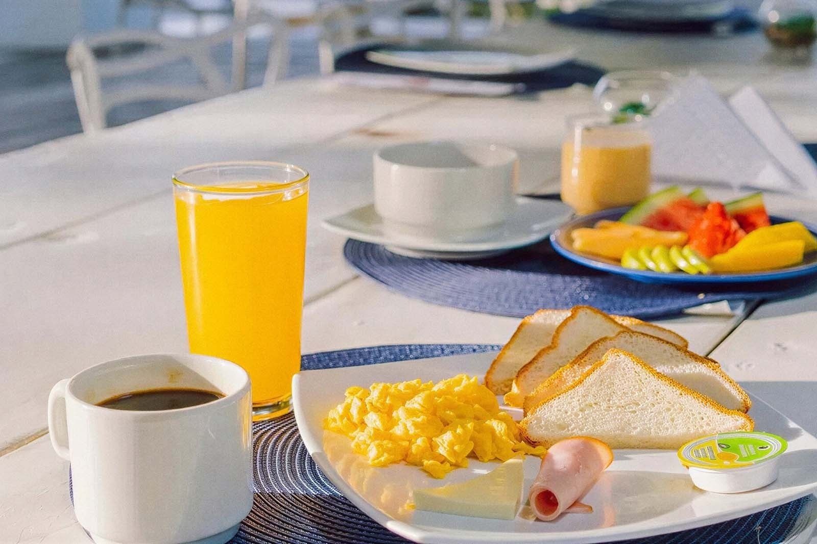 Enjoy a delicious breakfast at Marine Beach Club & Hotel: coffee, juice, eggs, toast, fruit.