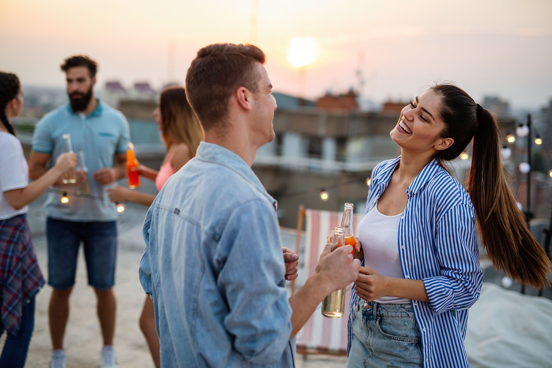 a group of people are having a party on a rooftop