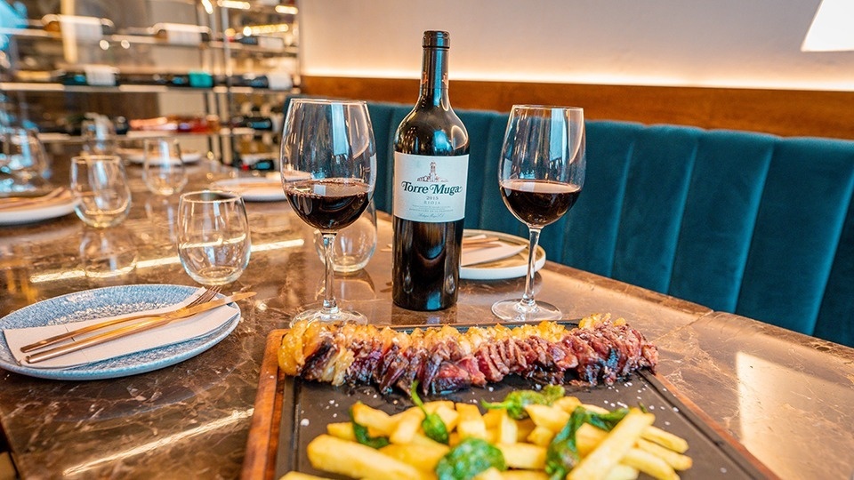 a bottle of torre magia wine sits on a table