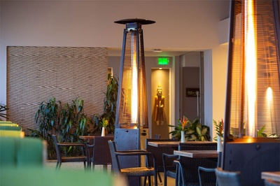 a restaurant with a green exit sign on the wall - 