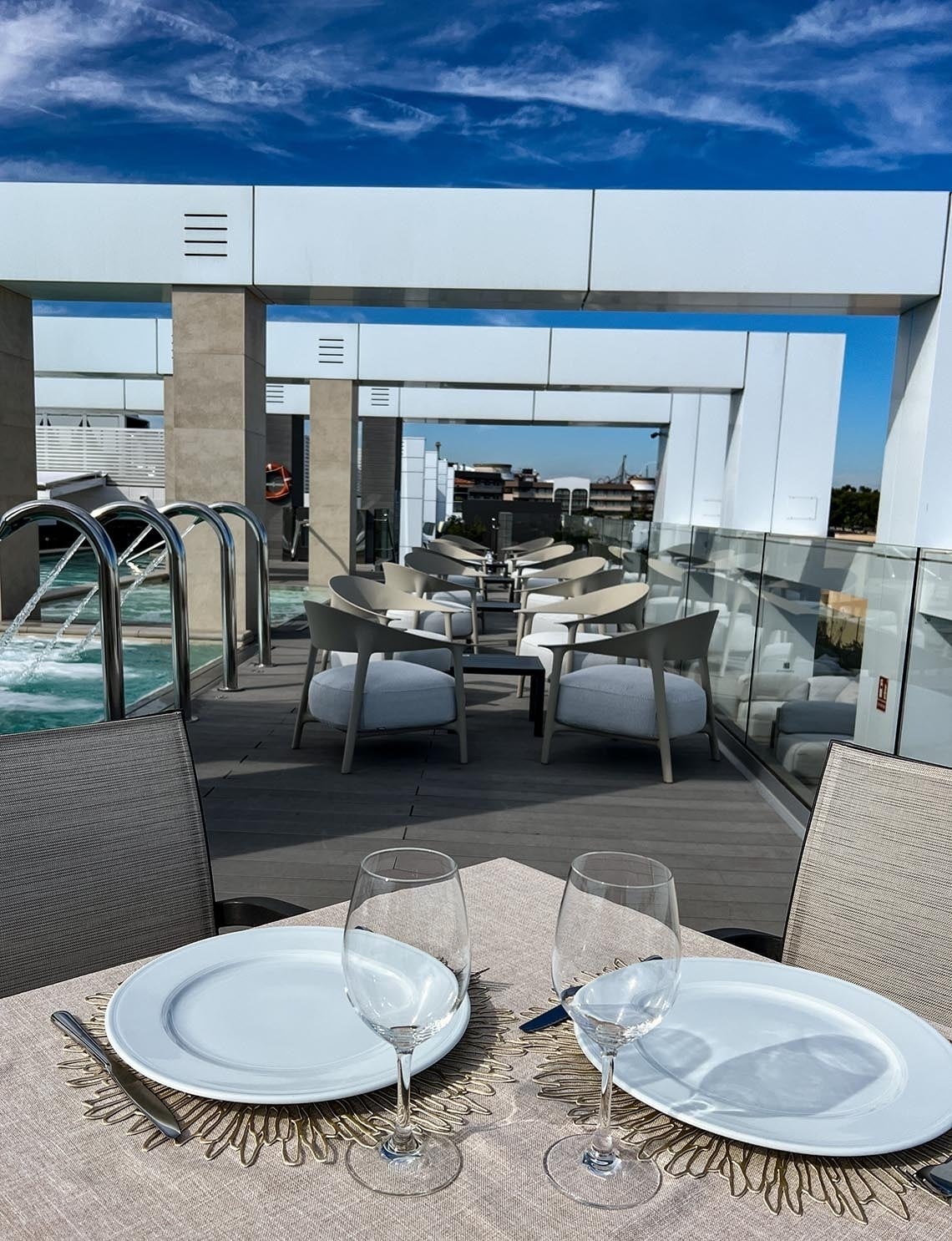 a white plate topped with rice tomatoes olives and mint leaves