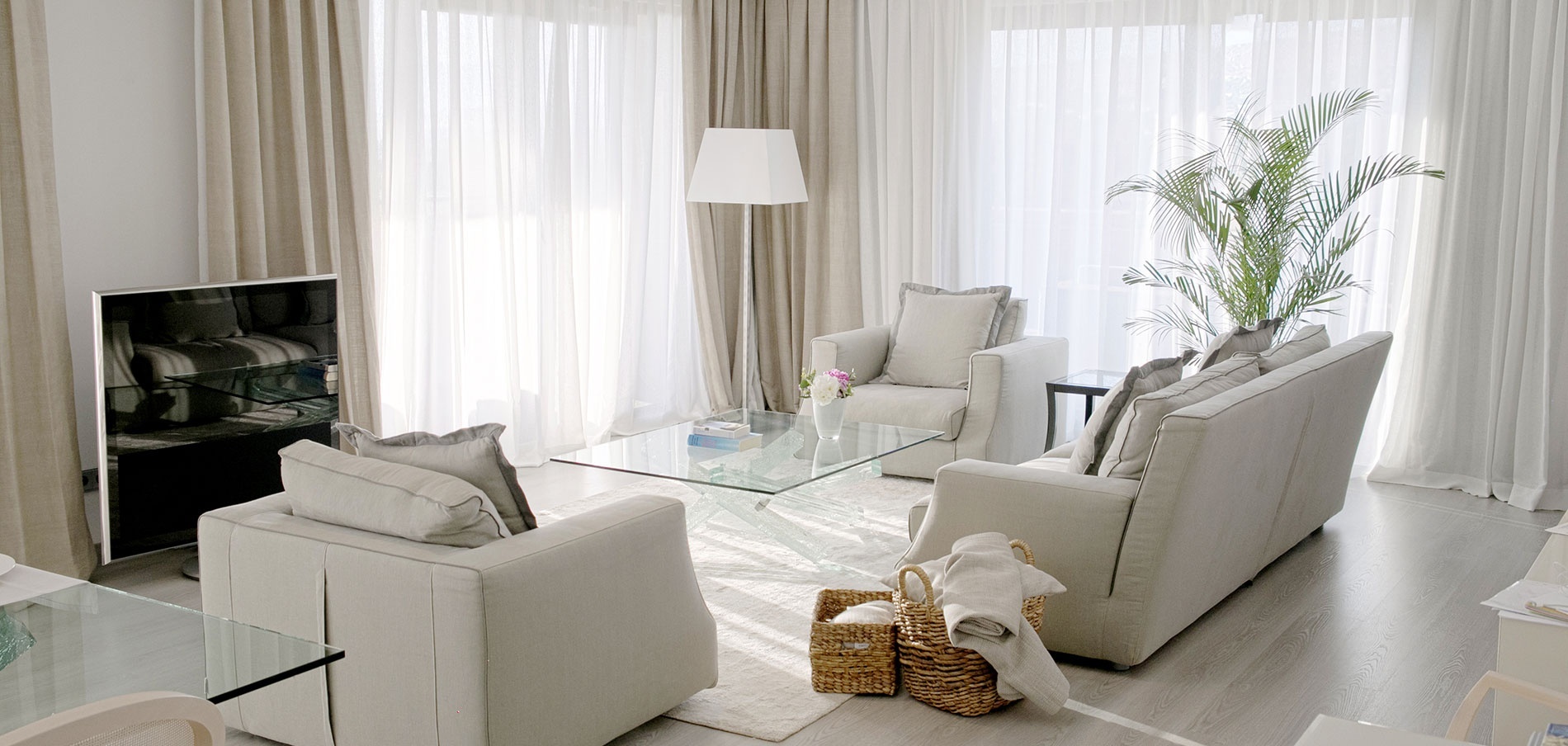 a living room with a couch and two chairs