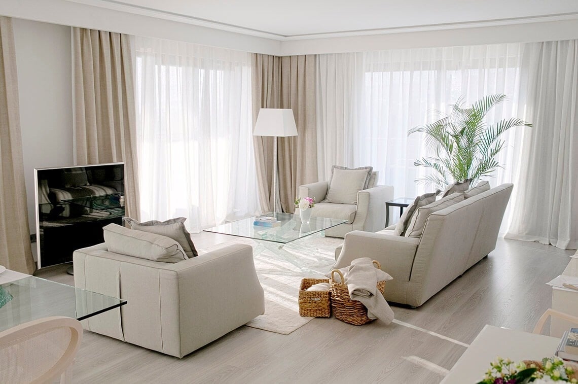 a living room with a couch and two chairs