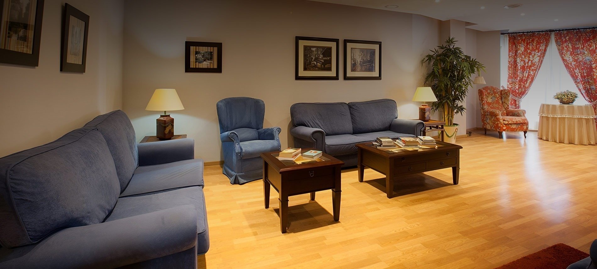 a hotel room with yellow pillows and a yellow chair