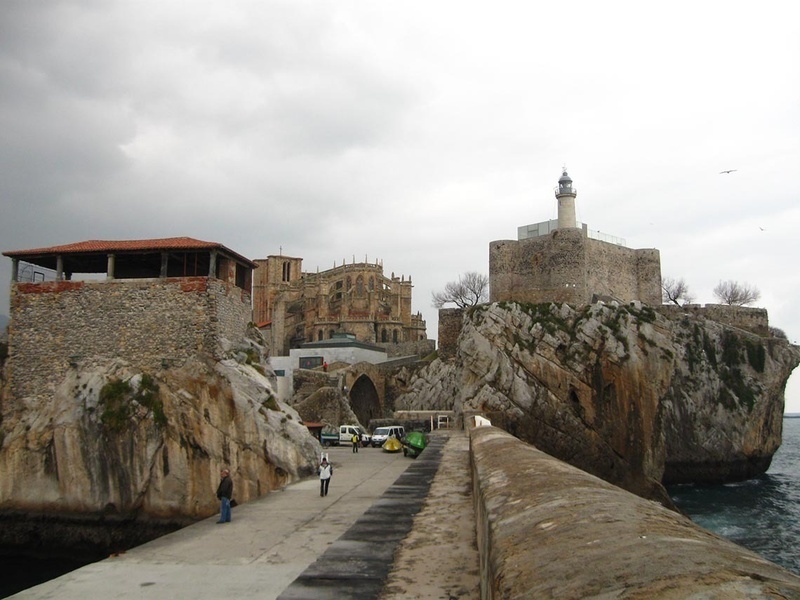 a castle with a lighthouse on top of it