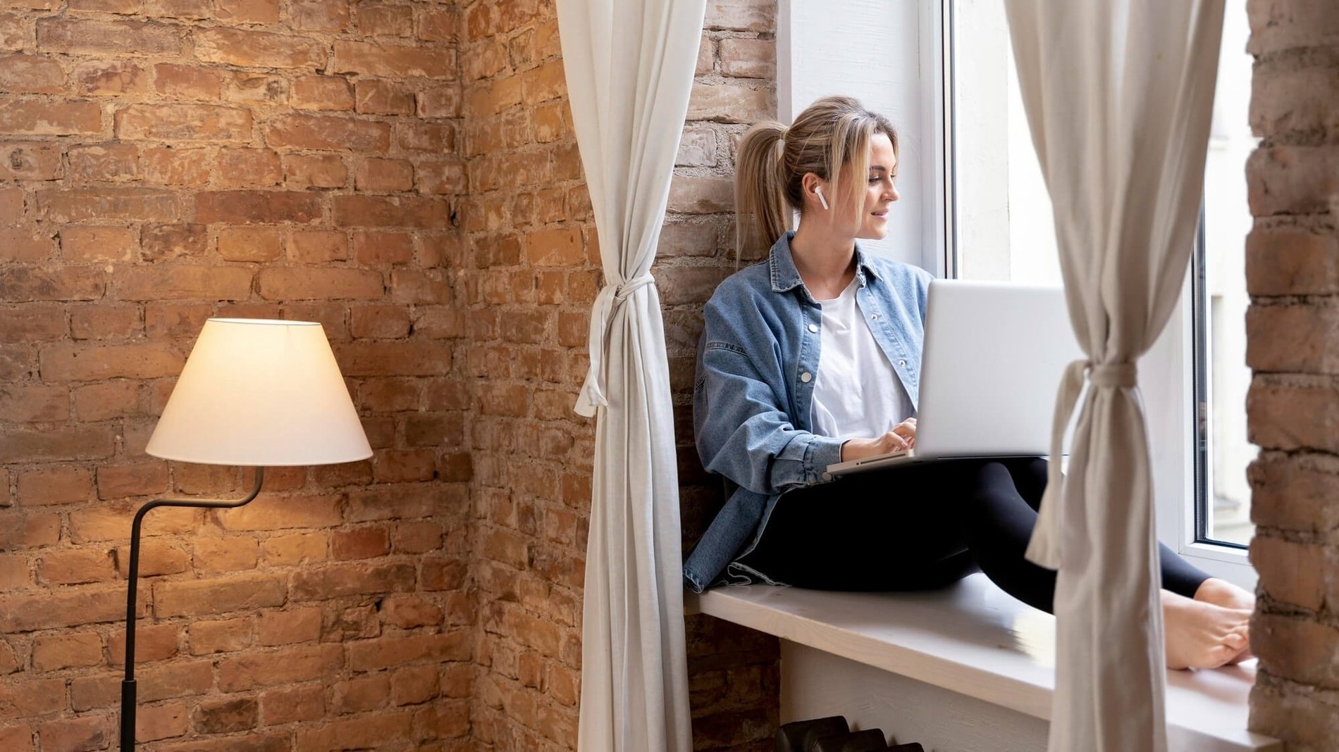 a woman is using a smart phone next to a keyboard