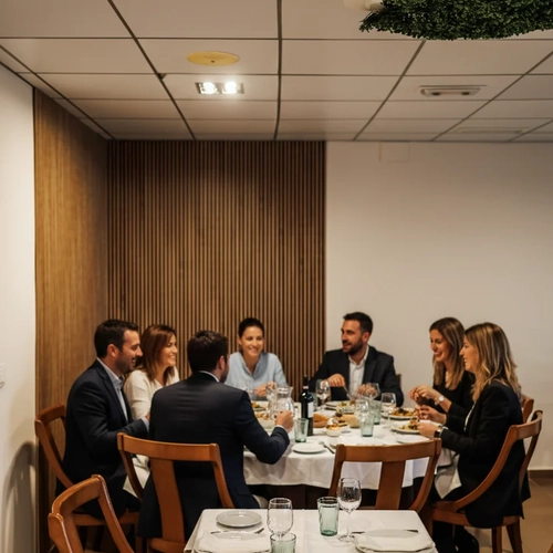 Business colleagues dining at a restaurant. Hotel Acosta Ciudad de la Música at a corporate event.
