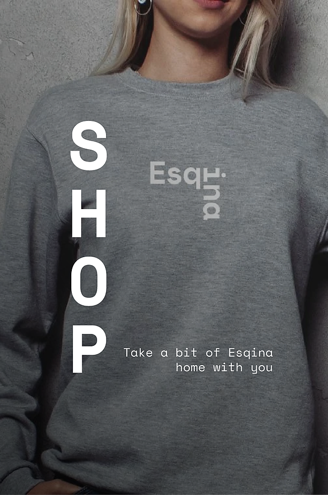 Sudadera de algodón gris con logo 'Esqina' y lema 'TEST3: Copia 4'.