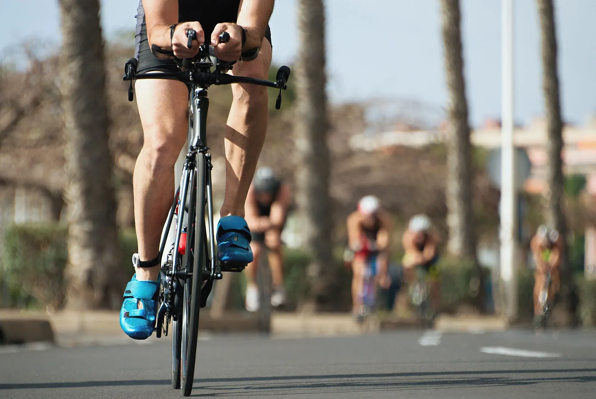 Cyclists racing, close-up view of a cyclist's legs, possible location: Hotel Puente Real ****, Torremolinos