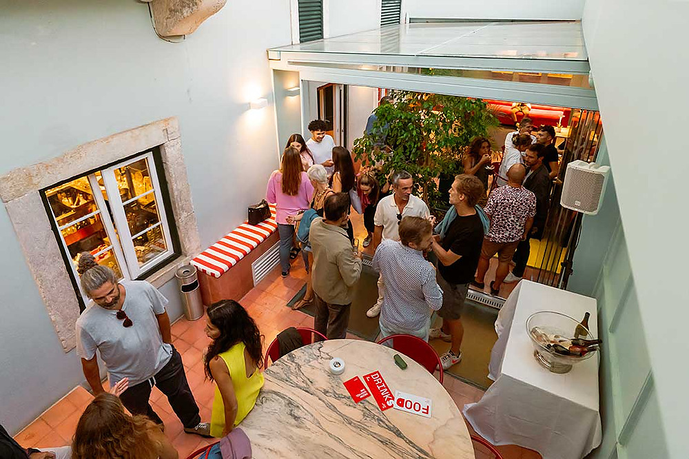 People mingling at a hotel rooftop event. Enjoy drinks and food at TEST3: Copia 4.