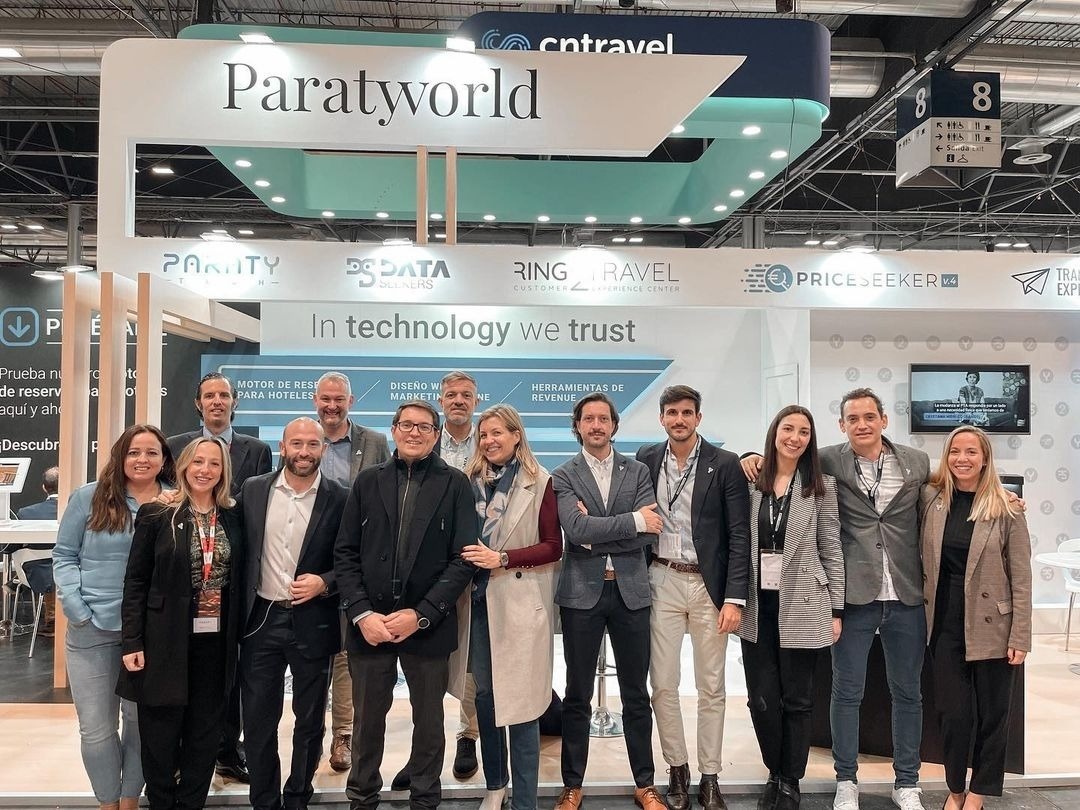a group of people standing in front of a paratworld booth