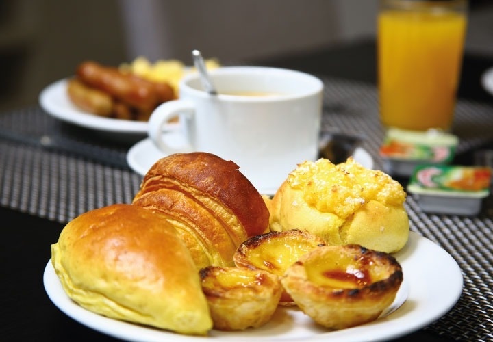 a plate of pastries and a cup of coffee on a table