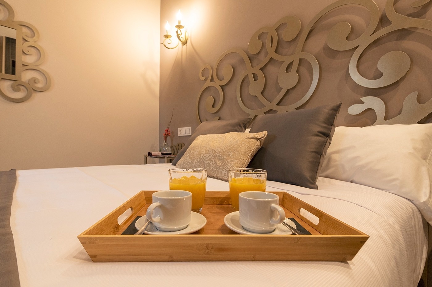 a balcony with a table and chairs overlooking the ocean