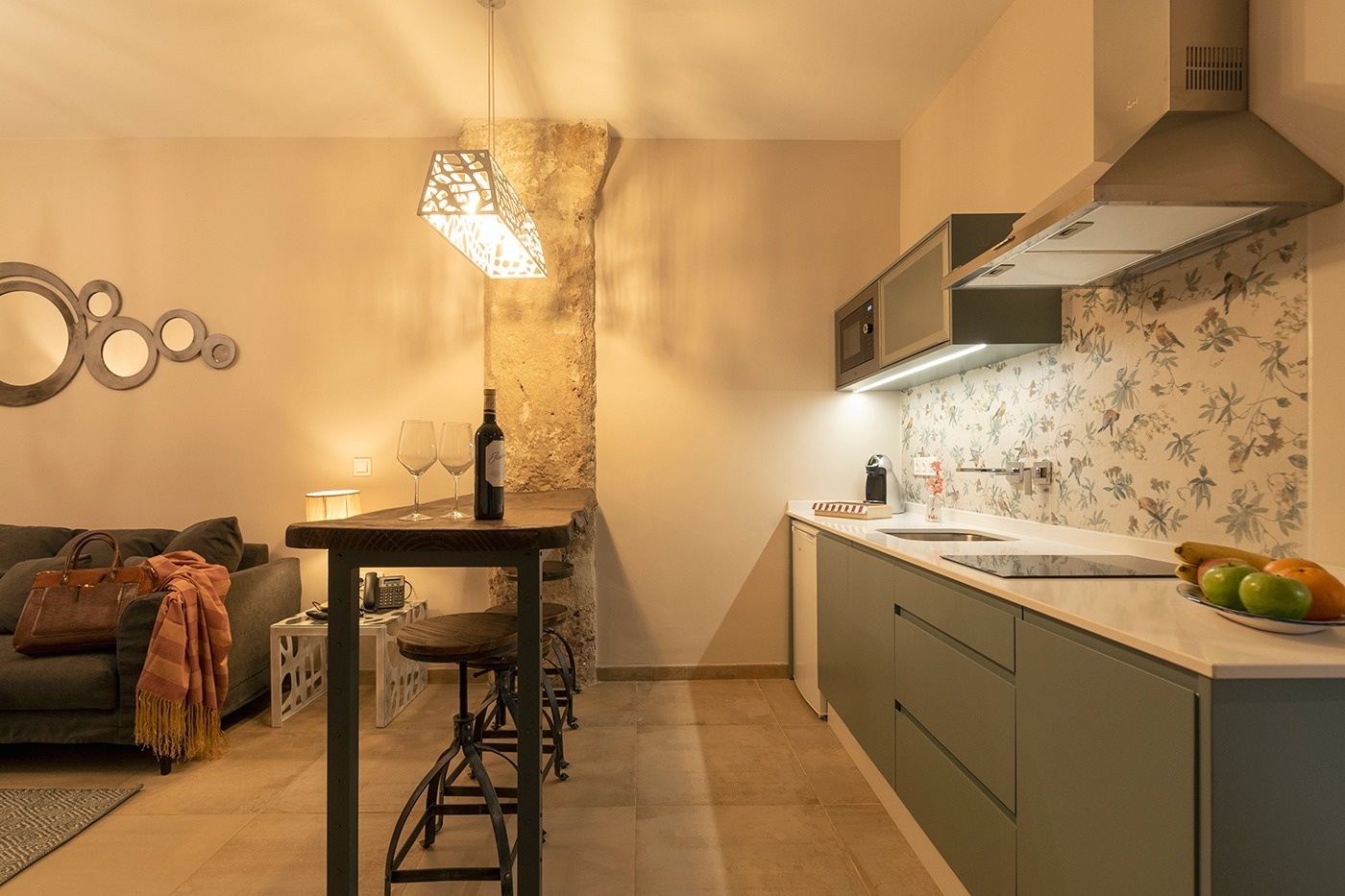 a bottle of wine sits on a counter in a kitchen
