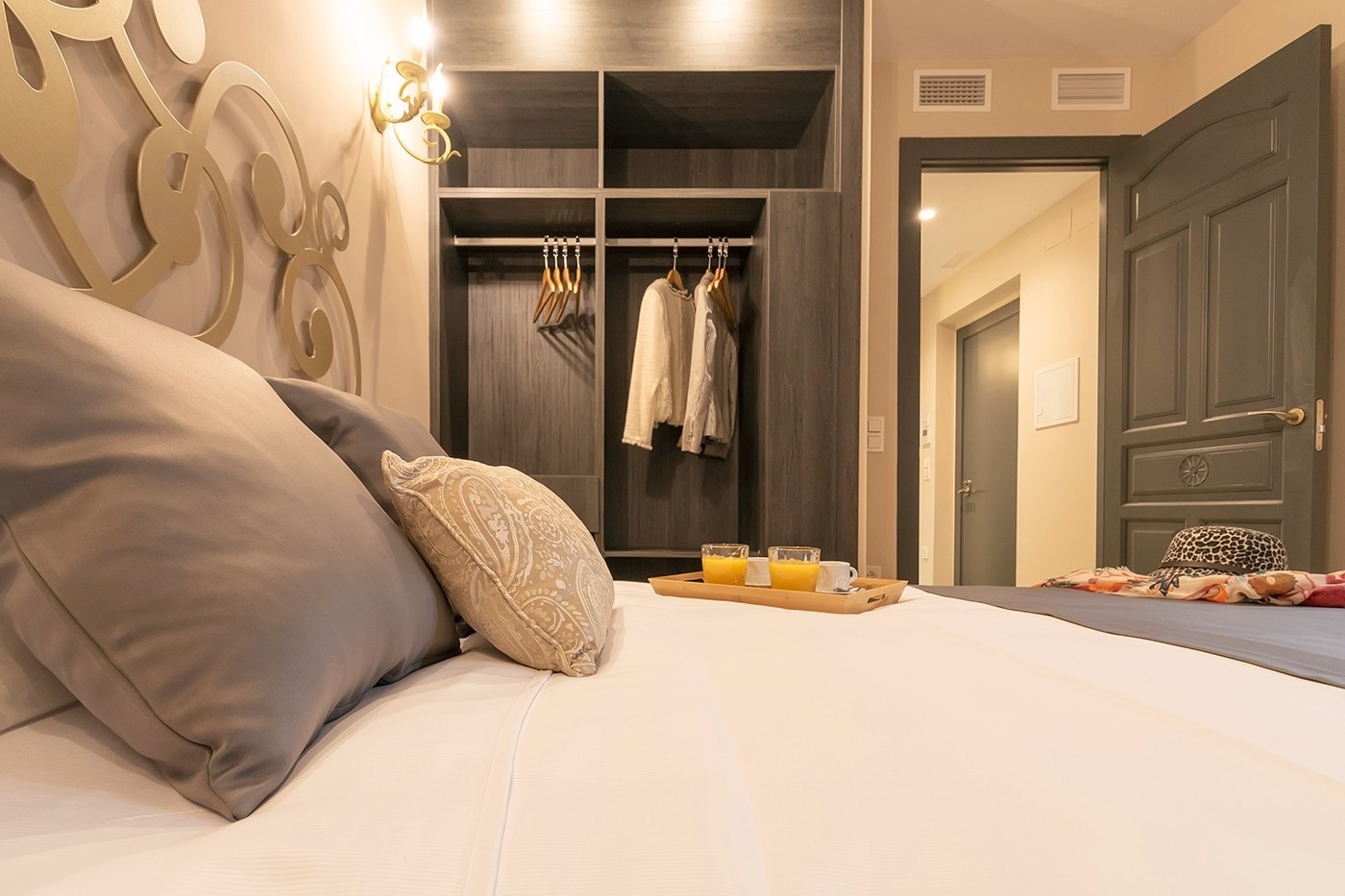 a balcony with a view of the ocean and palm trees