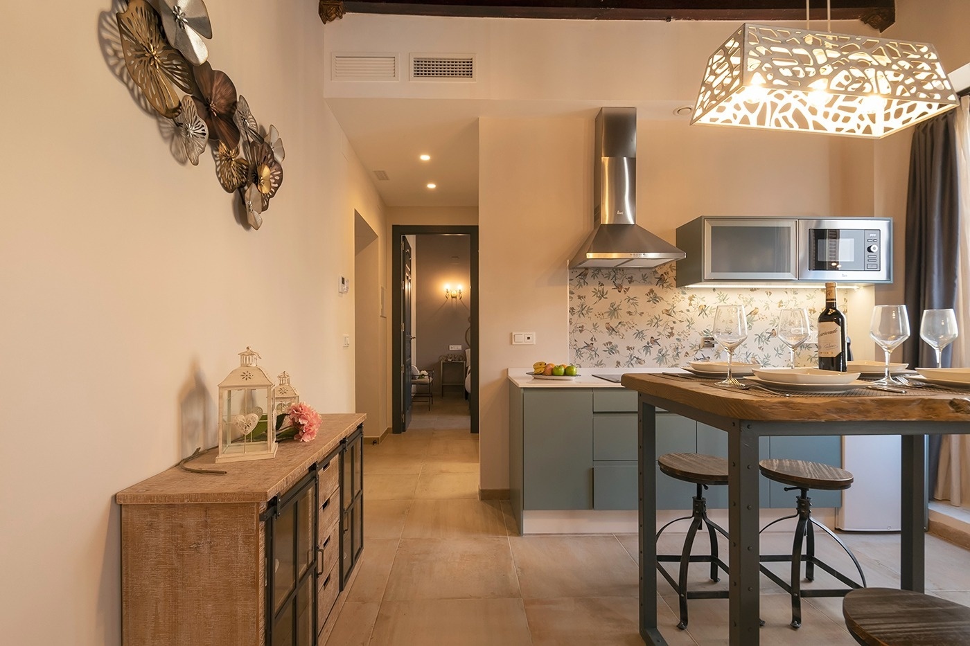 a kitchen with a bottle of wine on the counter