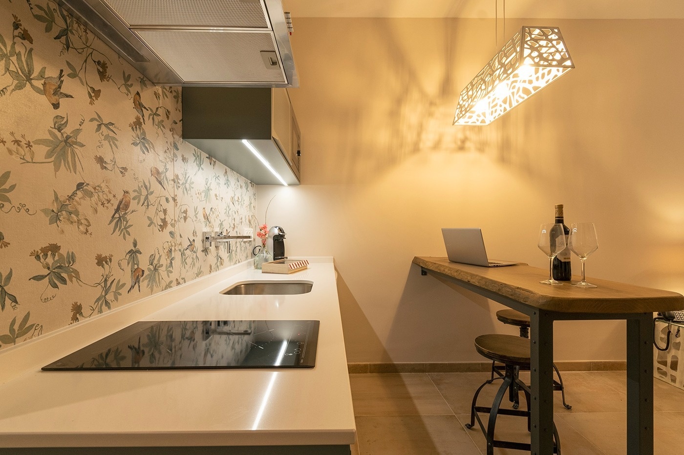 a bottle of wine sits on a table in a kitchen