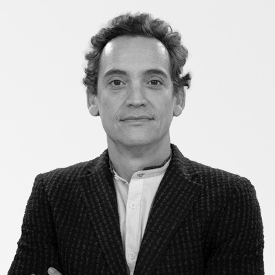 a man with his arms crossed is wearing a black jacket