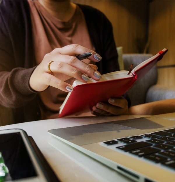 a laptop screen shows a price calendar for november 2022