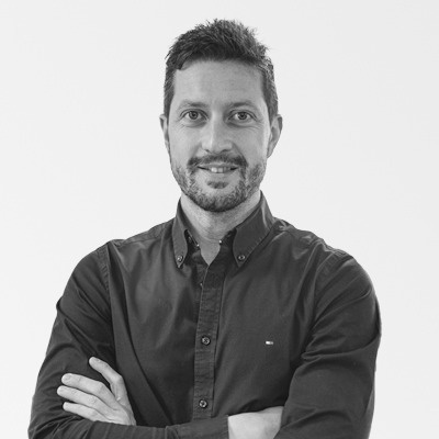 a man with his arms crossed is wearing a tommy hilfiger shirt