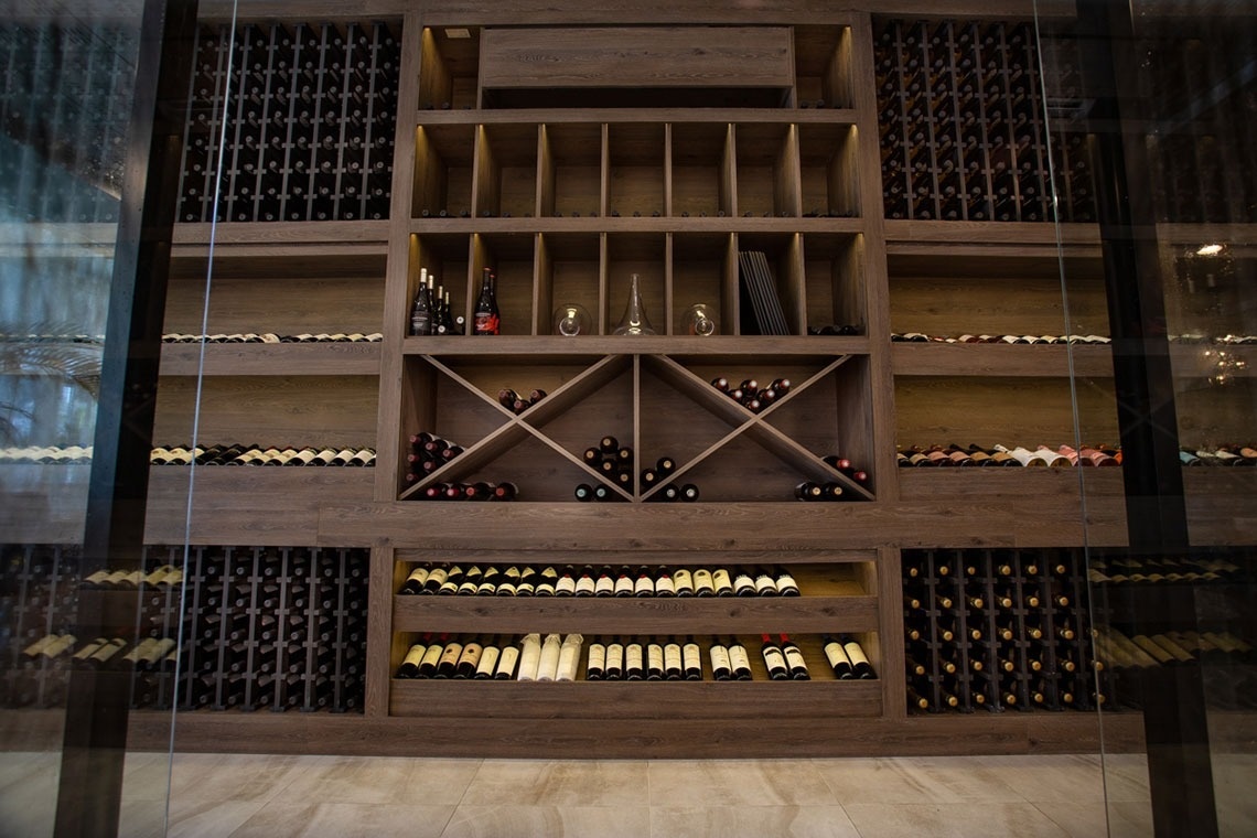 a wine cellar filled with lots of bottles of wine