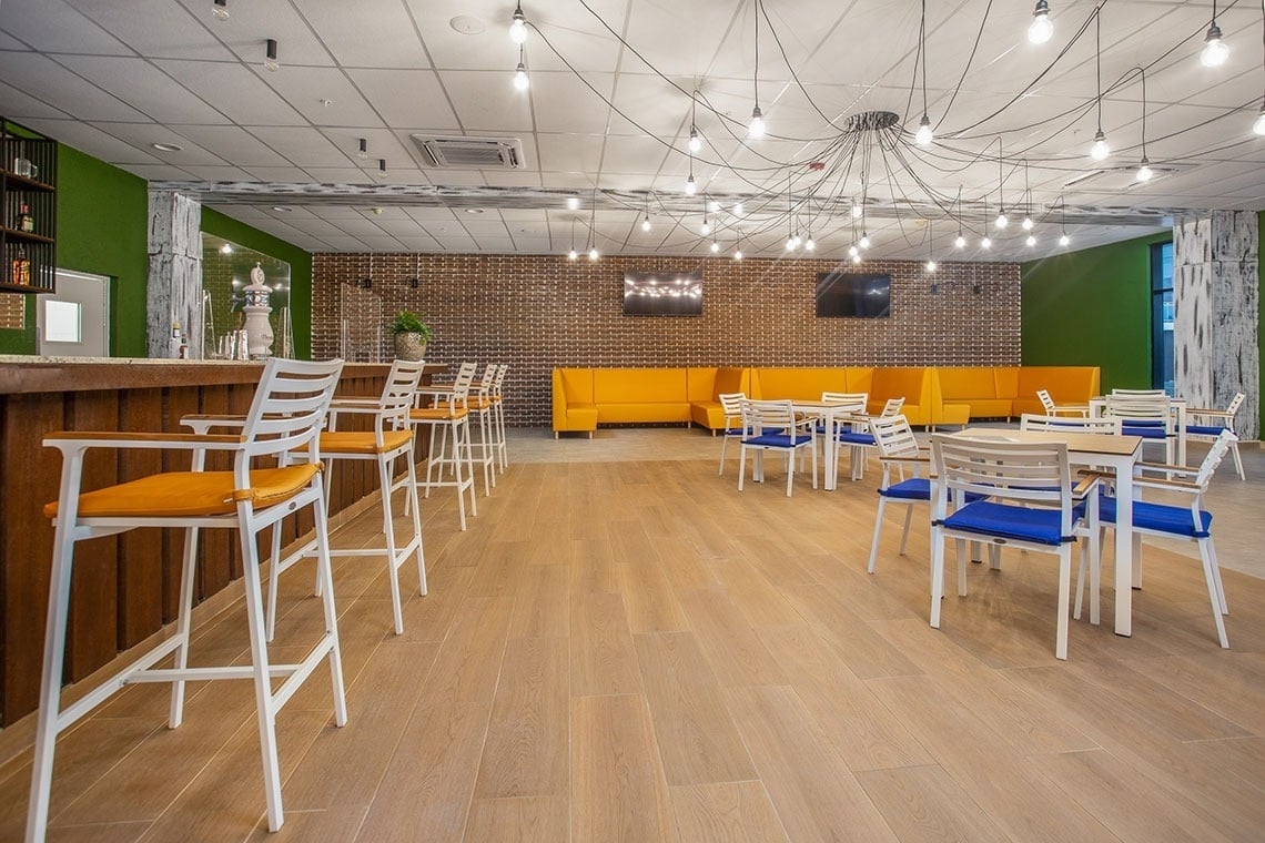 a restaurant with tables and chairs and a bar