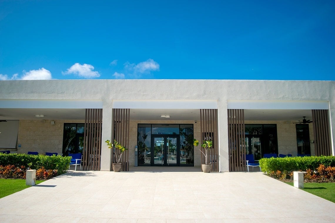 a white building with a blue sky in the background