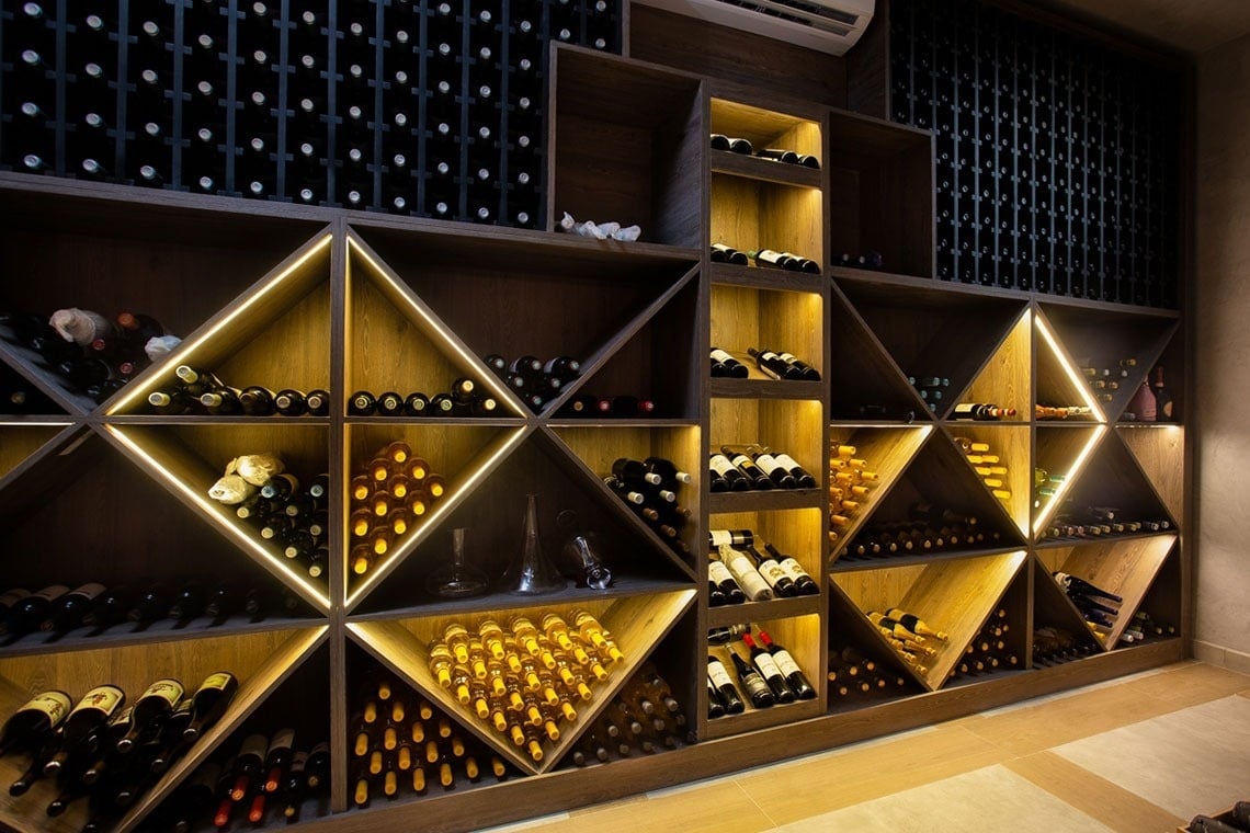a wine cellar filled with lots of bottles of wine