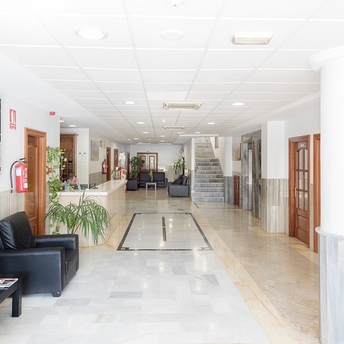 a hallway with a fire extinguisher on the wall