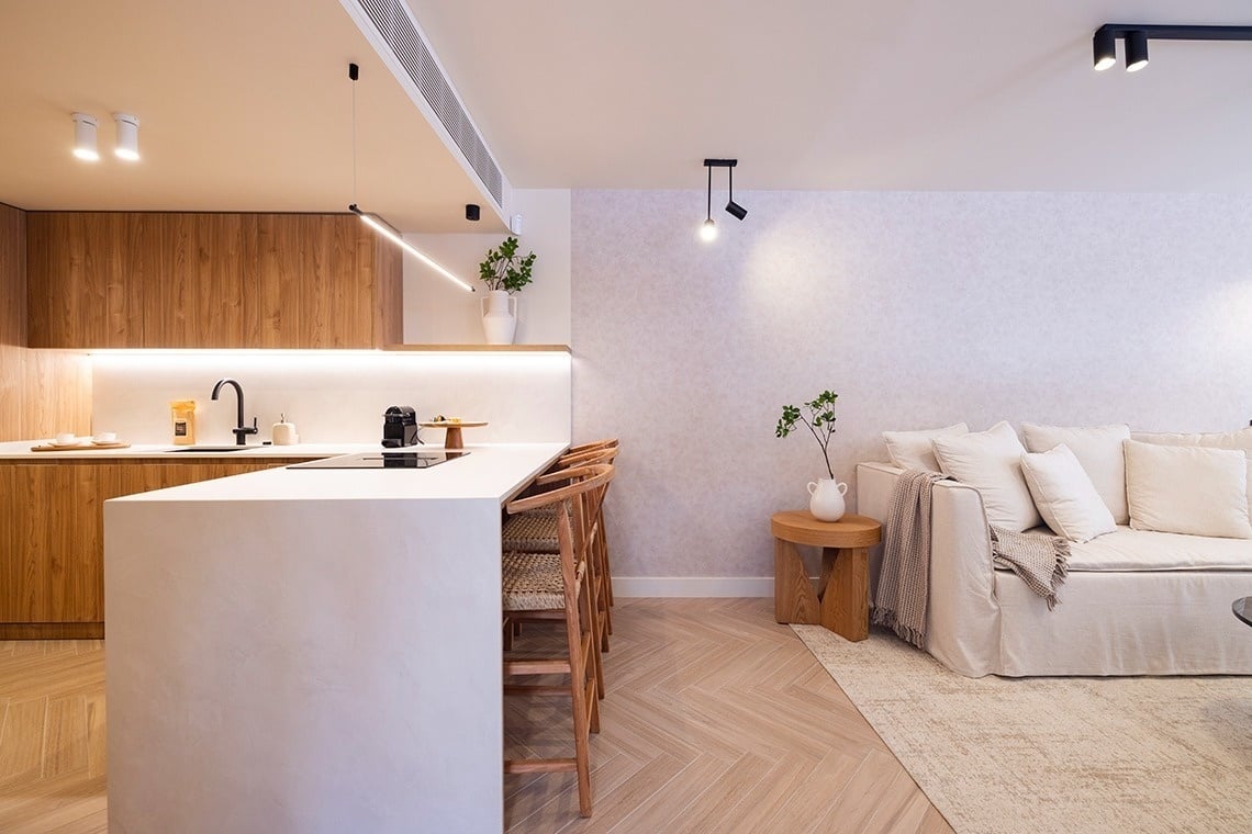 a kitchen with wooden cabinets and a white counter top