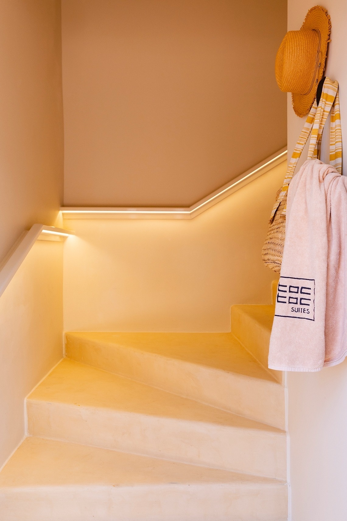 a staircase with a towel that says ebc suites on it