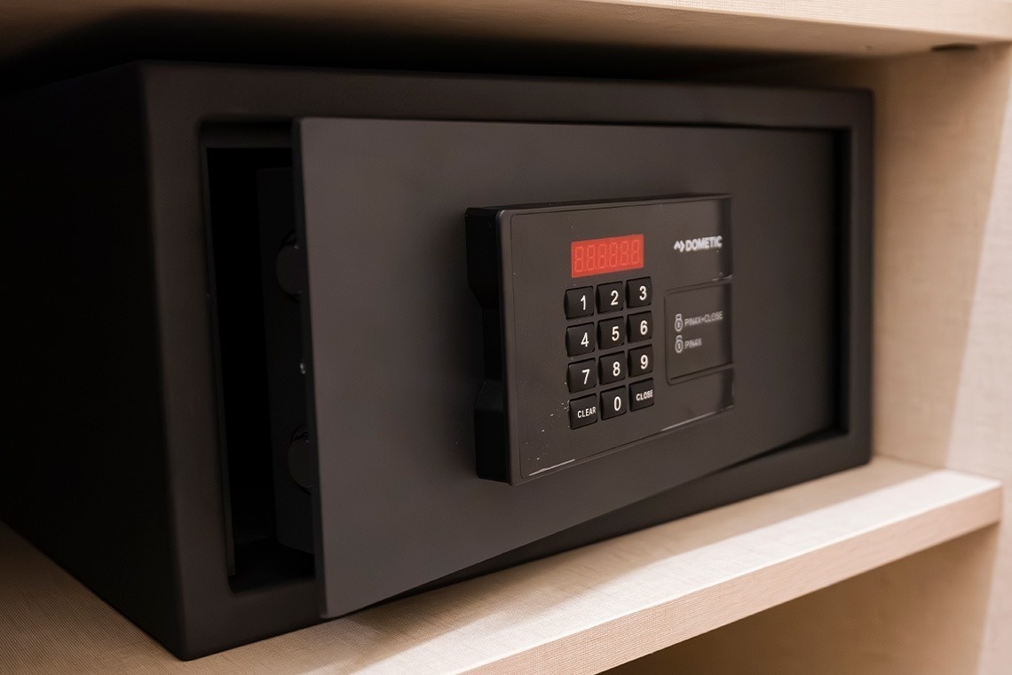 a dometic safe sits on a wooden shelf