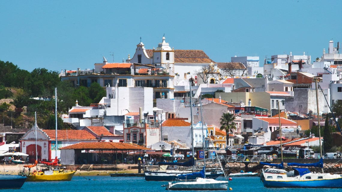 Golden beach in Torralvor: Rock arches and vibrant blue sea, ideal for your corporate retreat.