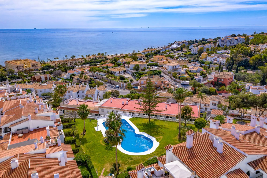 Aerial view of the Torrenueva Park complex with pool, gardens and the sea in the background=s1900