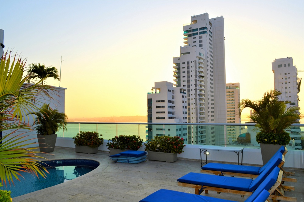 a swimming pool with a view of a city skyline