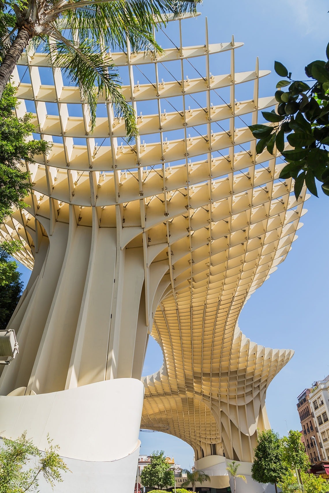 a large white building with a wooden roof