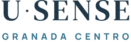 a blue letter u is surrounded by the word granada centro