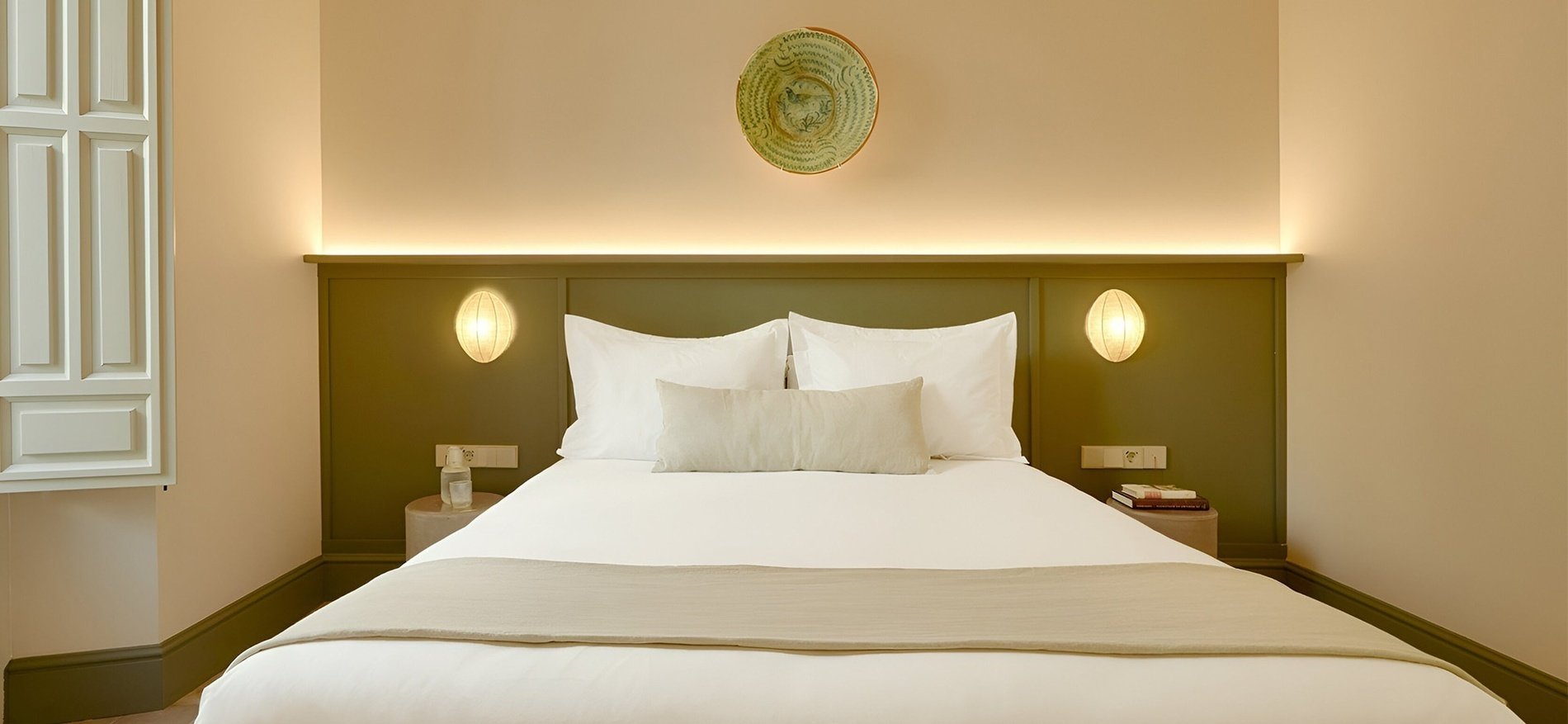 a balcony with a view of a city and mountains