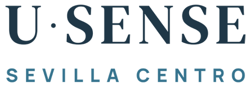a blue letter u is surrounded by the words sevilla centro