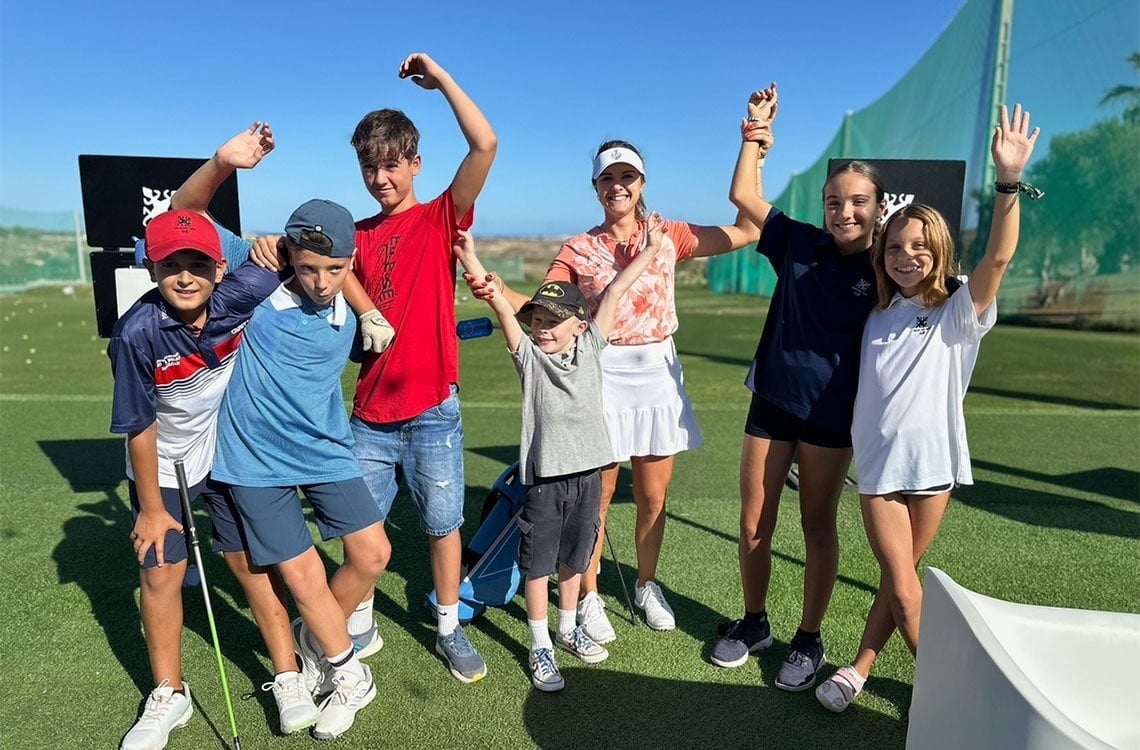 a group of young people are posing for a picture and one of them is wearing a shirt that says ' tiger ' on it