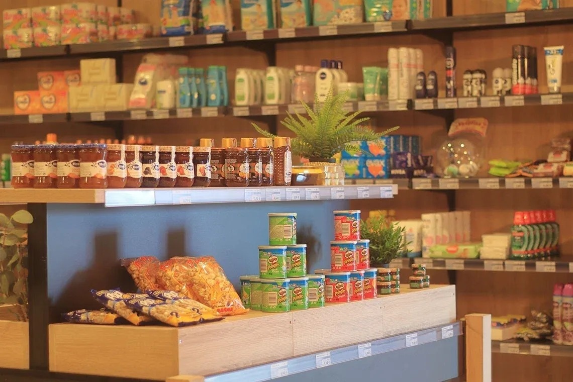 a store filled with lots of shelves and tables