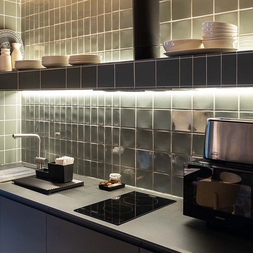 Modern kitchen in Apartamentos Vilafames Antic Palau with appliances and countertop.