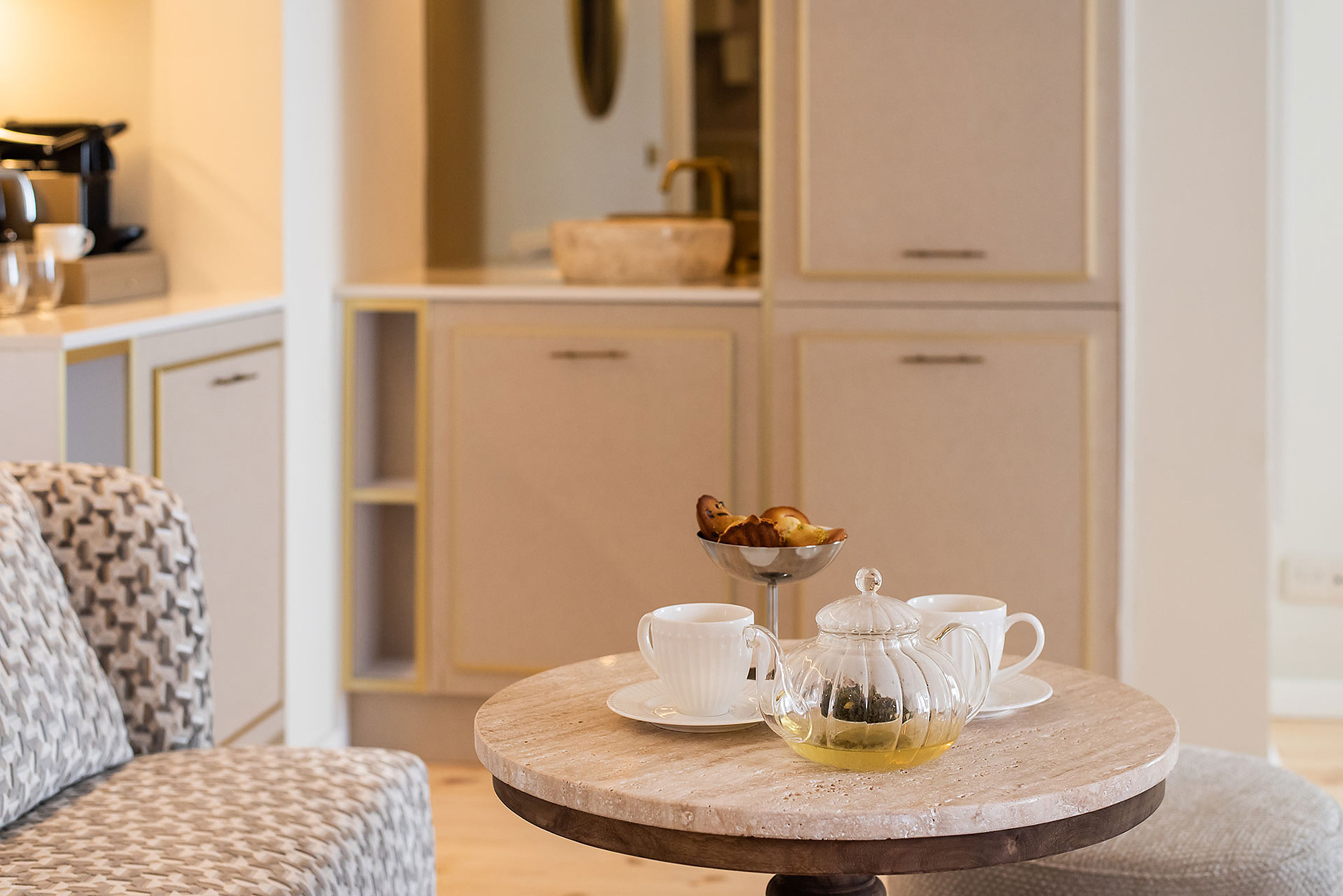 Enjoy Villa Dorothea in your suite: tea and pastries served on a round table.