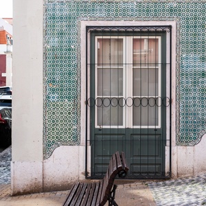 Historic Villa Dorothea street sign and bench, featuring traditional Portuguese tiles.